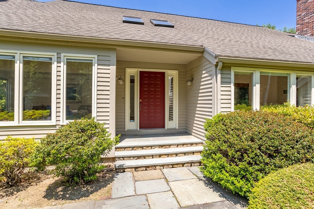 11 Farrar Road Lincoln, MA 01773 - Photo 3 of 37 a front view of a house with a lots of flowers