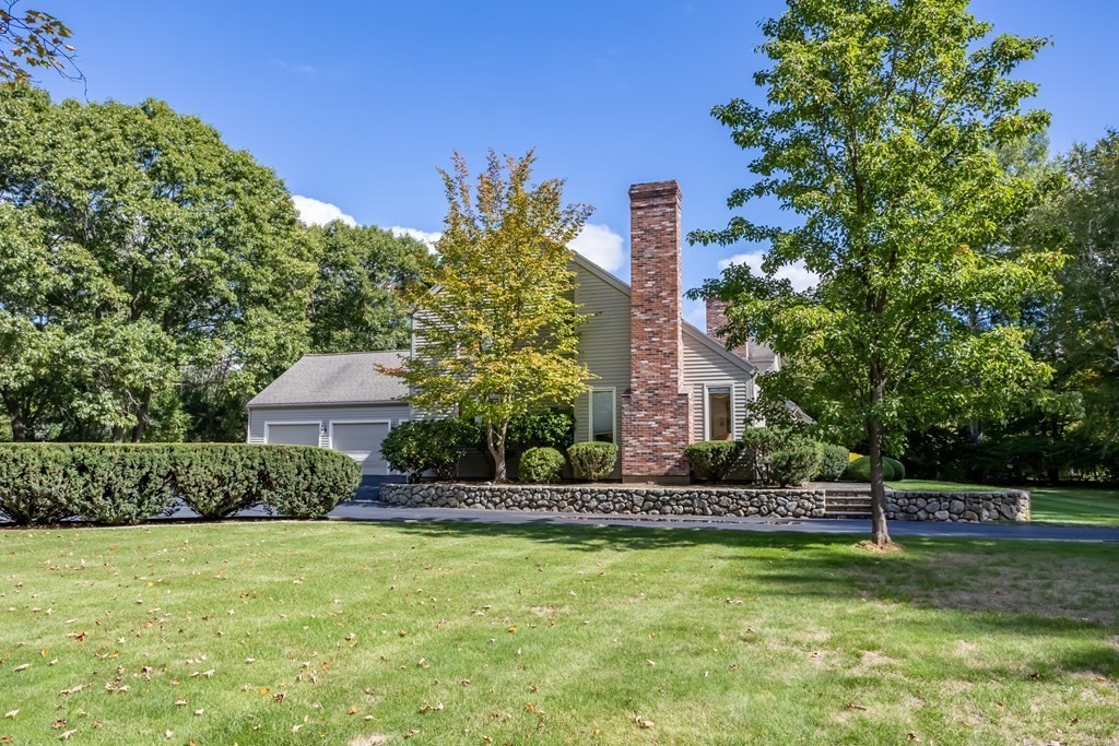 11 Farrar Road Lincoln, MA 01773 - Photo 33 of 37 a front view of a house with a yard and palm trees