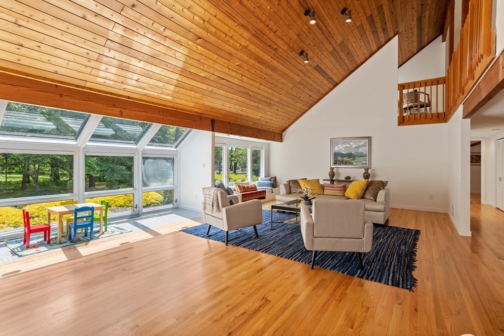 11 Farrar Road Lincoln, MA 01773 - Photo 10 of 37 a living room with fireplace furniture and a large window