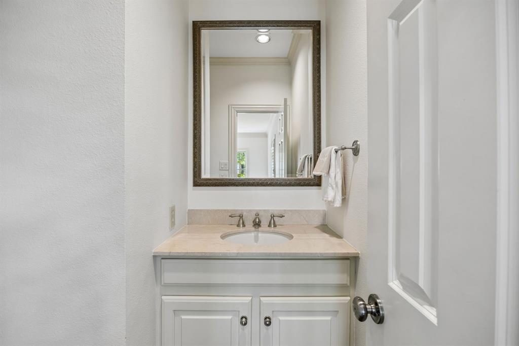 3101 Rosedale Avenue, Unit D University Park, TX 75205 - Photo 21 of 23 a bathroom with a granite countertop sink and a mirror