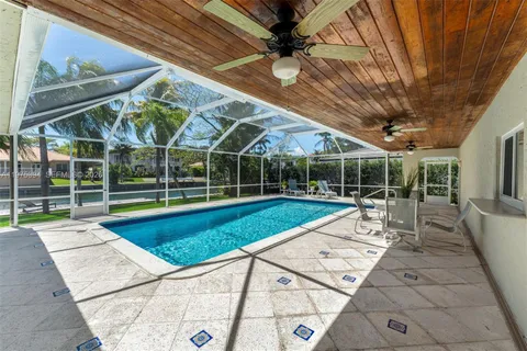 a view of swimming pool with seating space