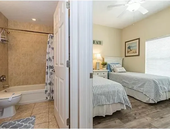 a bedroom with a bed and a shower