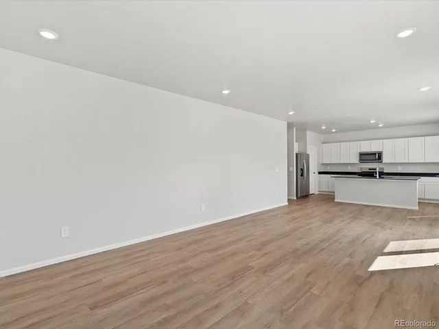a view of kitchen with wooden floor