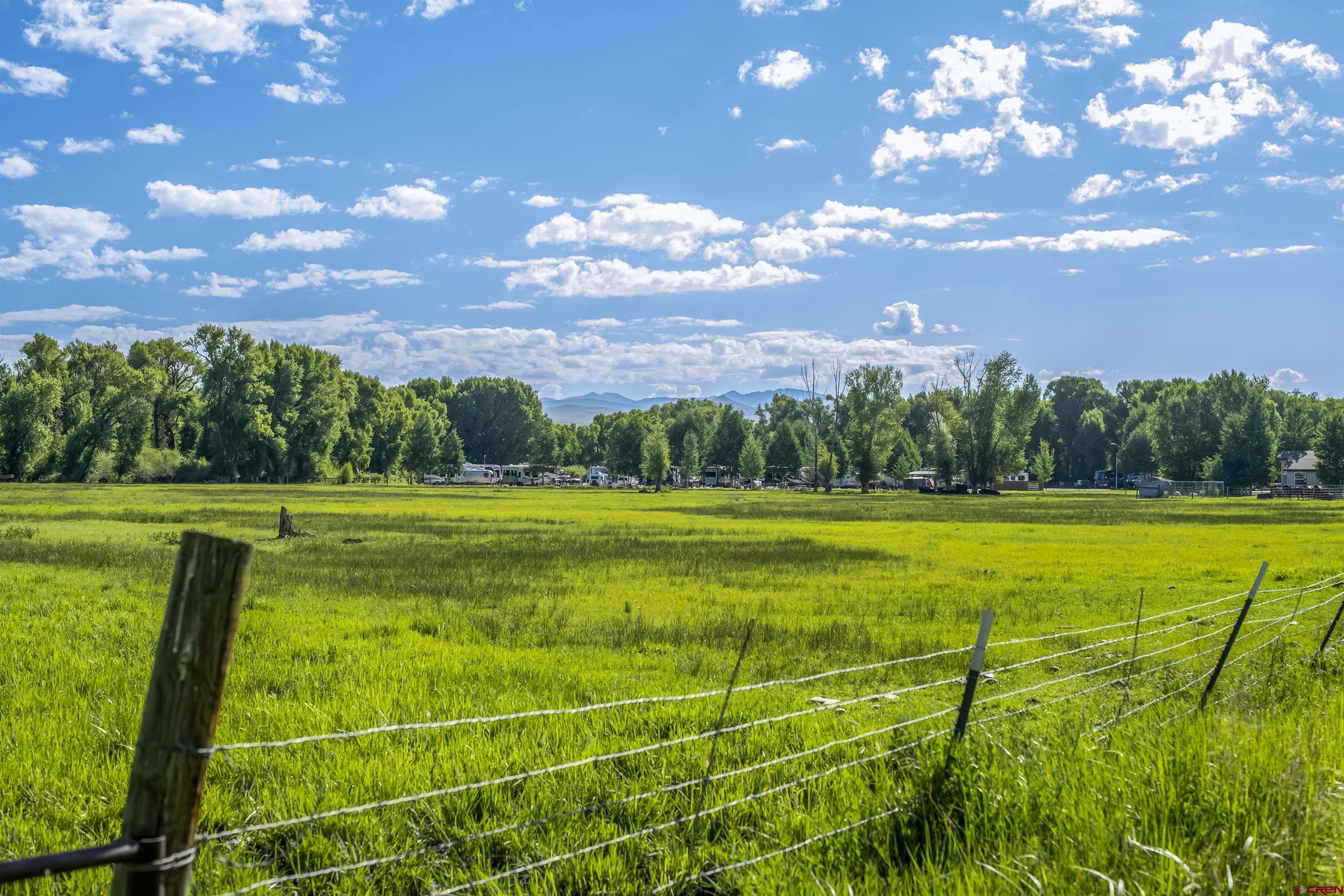 Rainbow Acres Lane Gunnison, CO 81230 - Photo 11 of 19 a view of a house with a big yard