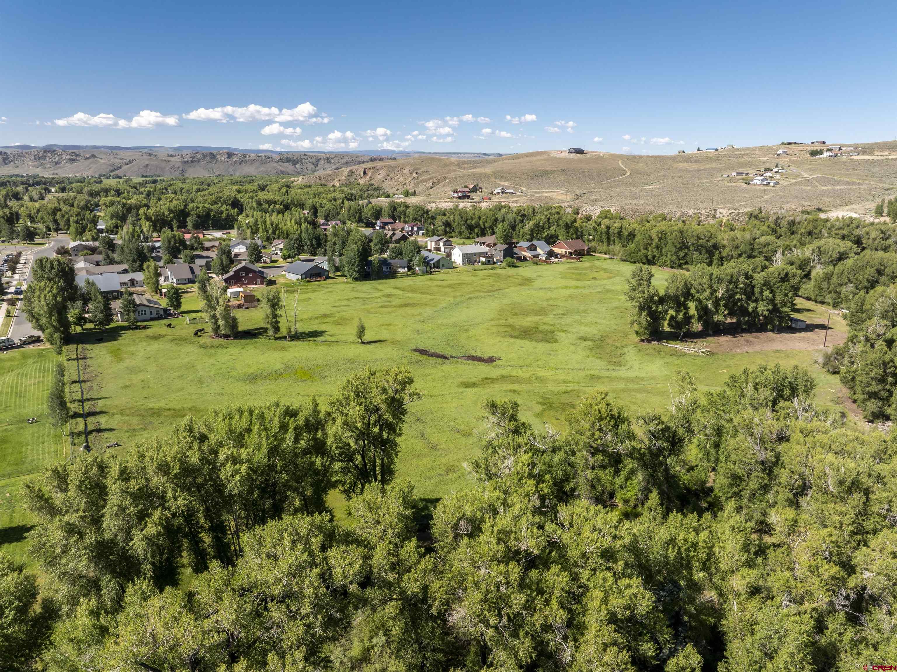 Rainbow Acres Lane Gunnison, CO 81230 - Photo 8 of 19 a view of a lake with houses in the back