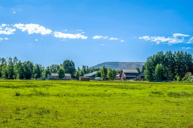 a view of a house with a big yard