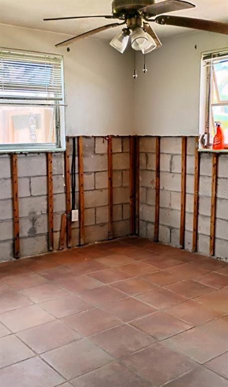 510 Marlyn Way Madeira Beach, FL 33708 - Photo 19 of 32 an empty room with windows