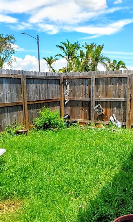 510 Marlyn Way Madeira Beach, FL 33708 - Photo 26 of 32 a view of a backyard with sitting area