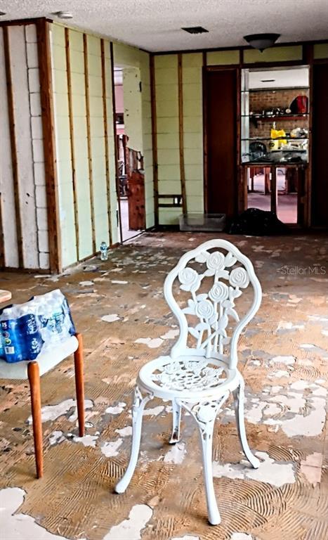 510 Marlyn Way Madeira Beach, FL 33708 - Photo 6 of 32 a bedroom with a bed and a table in it