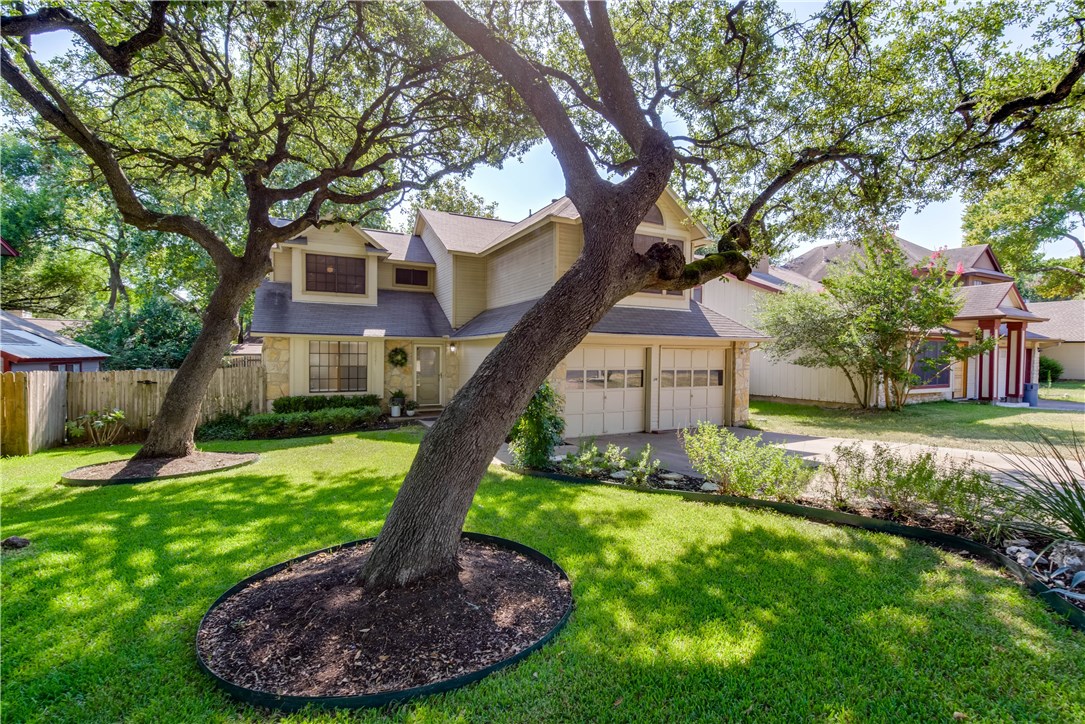 13021 Amarillo Avenue Austin, TX 78729 - Photo 1 of 1 a view of a house with a yard