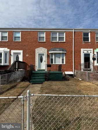 a front view of a house with yard