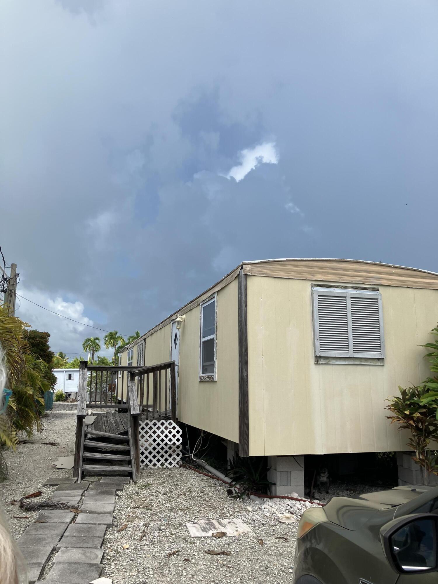 330 Spica Lane Key West, FL 33040 - Photo 6 of 6 a front view of a house with a yard
