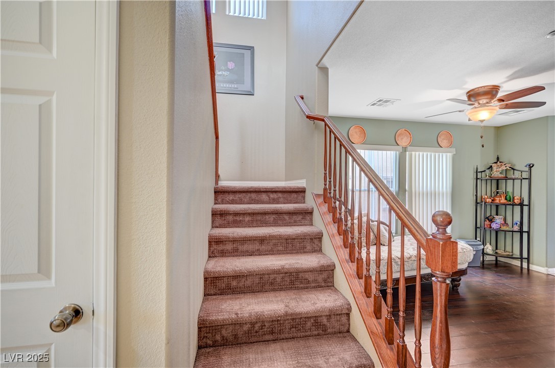1168 Paradise River Road Henderson, NV 89002 - Photo 13 of 29 Stairs featuring ceiling fan and wood finished floors