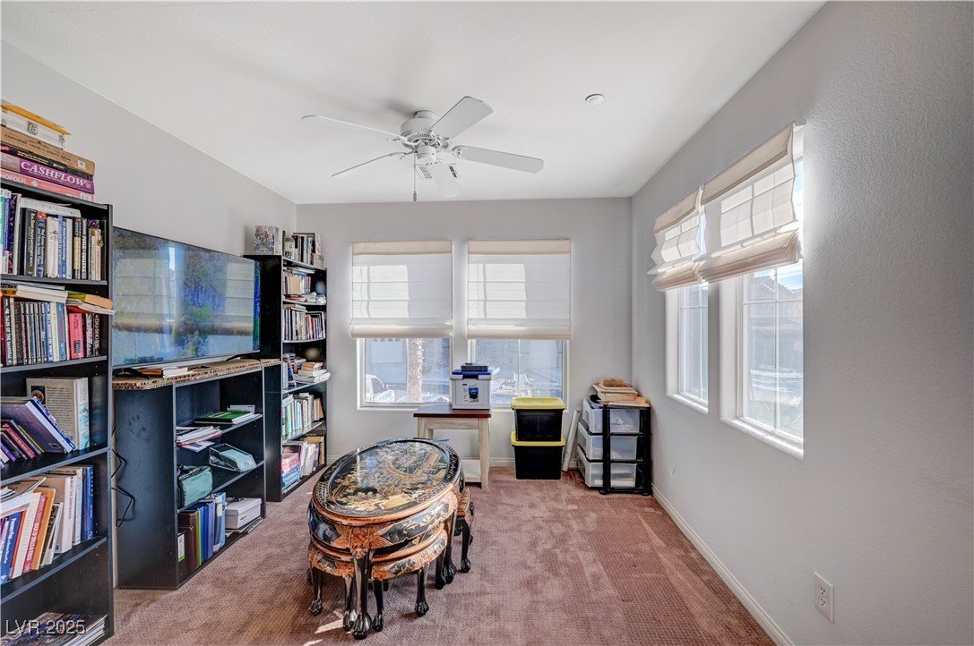1168 Paradise River Road Henderson, NV 89002 - Photo 14 of 29 Sitting room featuring carpet floors, a ceiling fan, and healthy amount of natural light