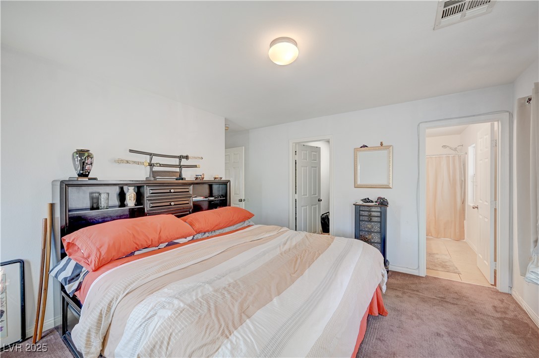 1168 Paradise River Road Henderson, NV 89002 - Photo 20 of 29 Carpeted bedroom with baseboards