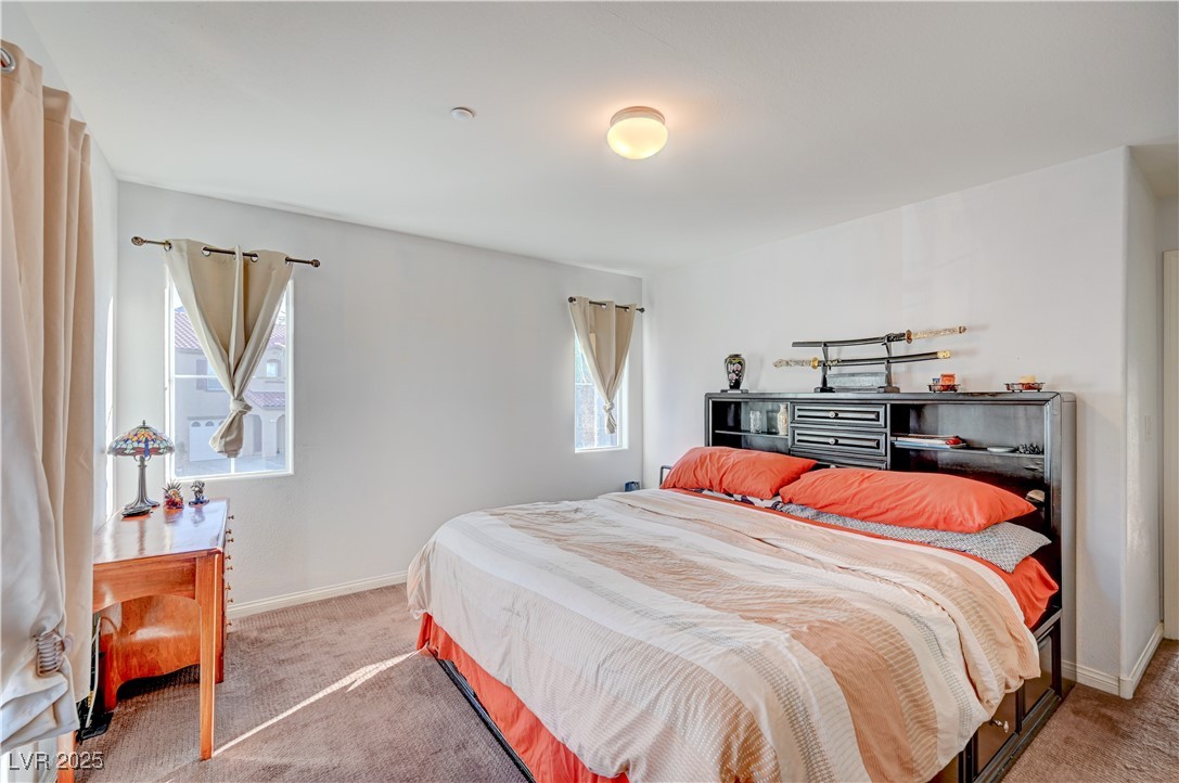 1168 Paradise River Road Henderson, NV 89002 - Photo 21 of 29 Bedroom with carpet flooring