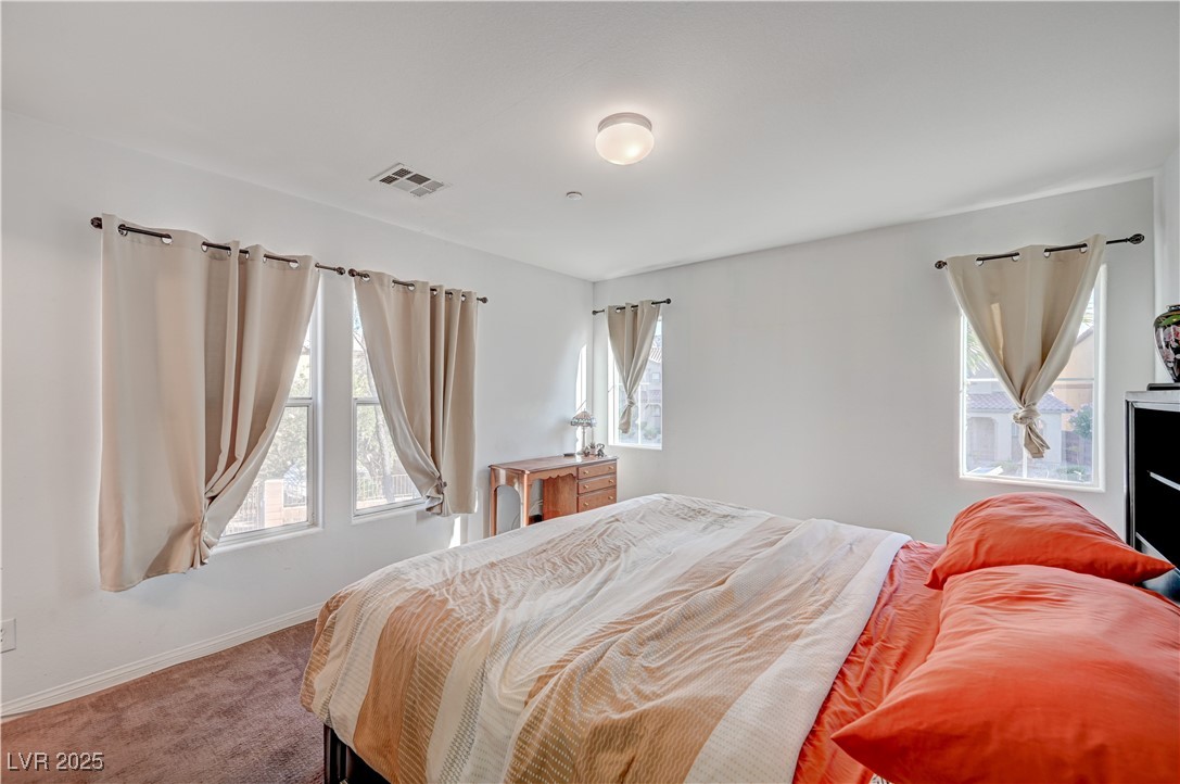 1168 Paradise River Road Henderson, NV 89002 - Photo 22 of 29 Bedroom featuring carpet and baseboards