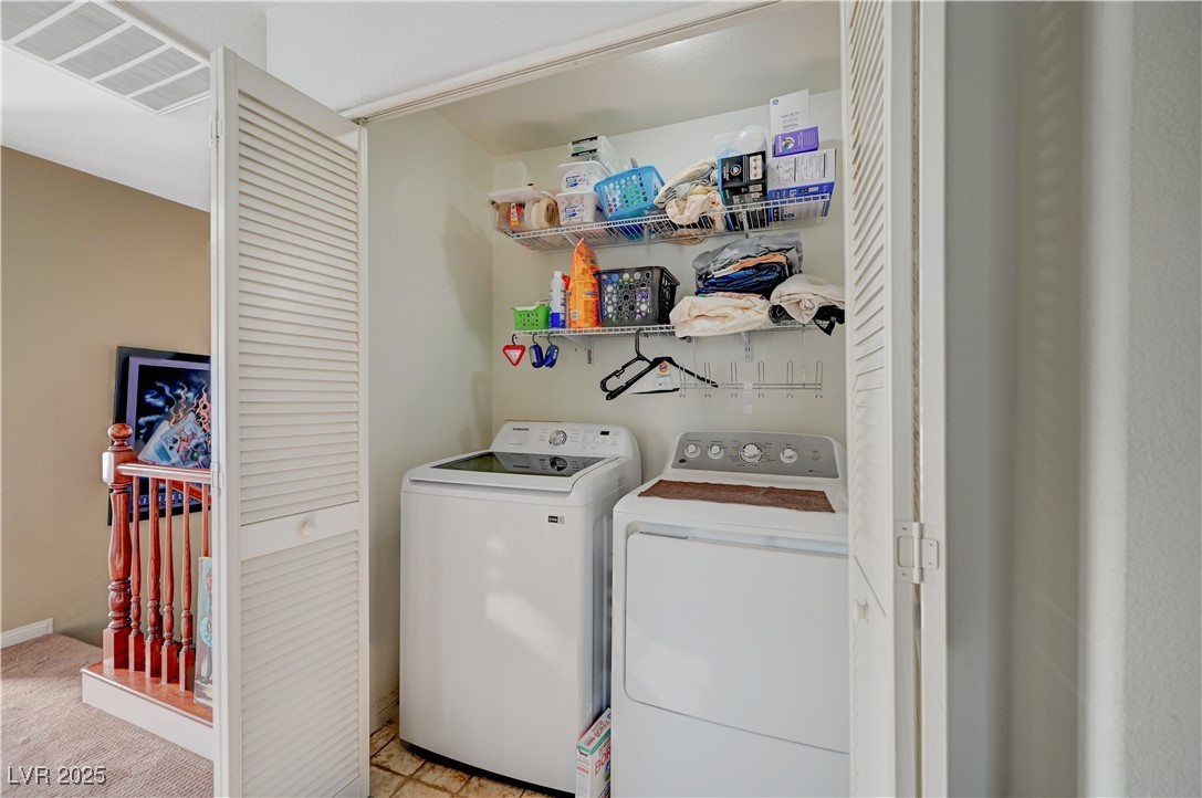 1168 Paradise River Road Henderson, NV 89002 - Photo 25 of 29 Laundry room upstairs with washing machine and clothes dryer