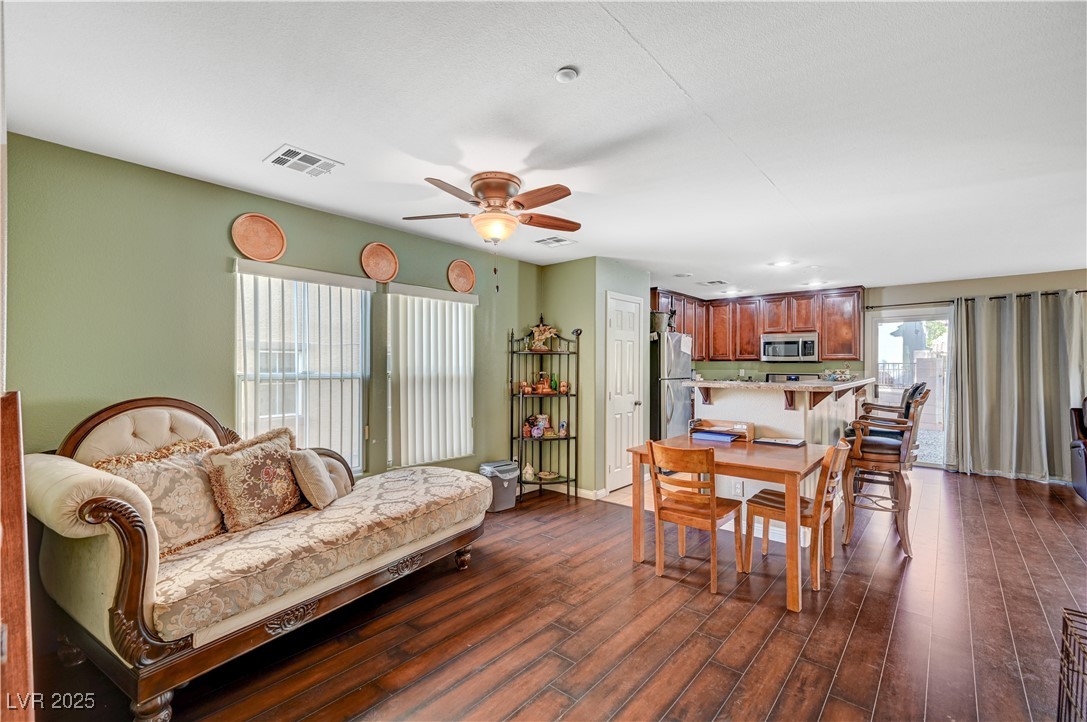 1168 Paradise River Road Henderson, NV 89002 - Photo 3 of 29 Dining space with dark wood-style floors and ceiling fan