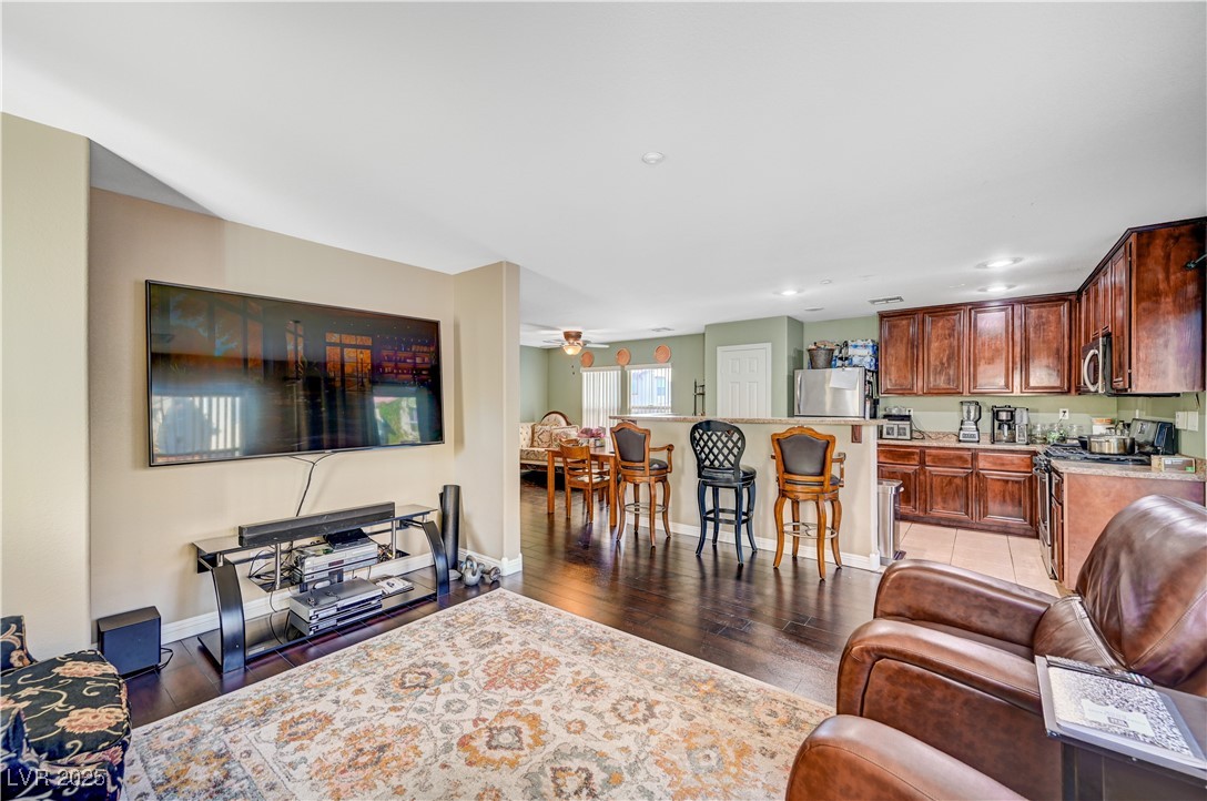 1168 Paradise River Road Henderson, NV 89002 - Photo 6 of 29 Living area with dark wood-style floors, a ceiling fan, and recessed lighting