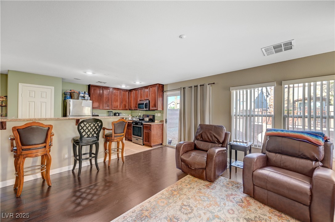 1168 Paradise River Road Henderson, NV 89002 - Photo 7 of 29 Living room with light wood finished floors and recessed lighting
