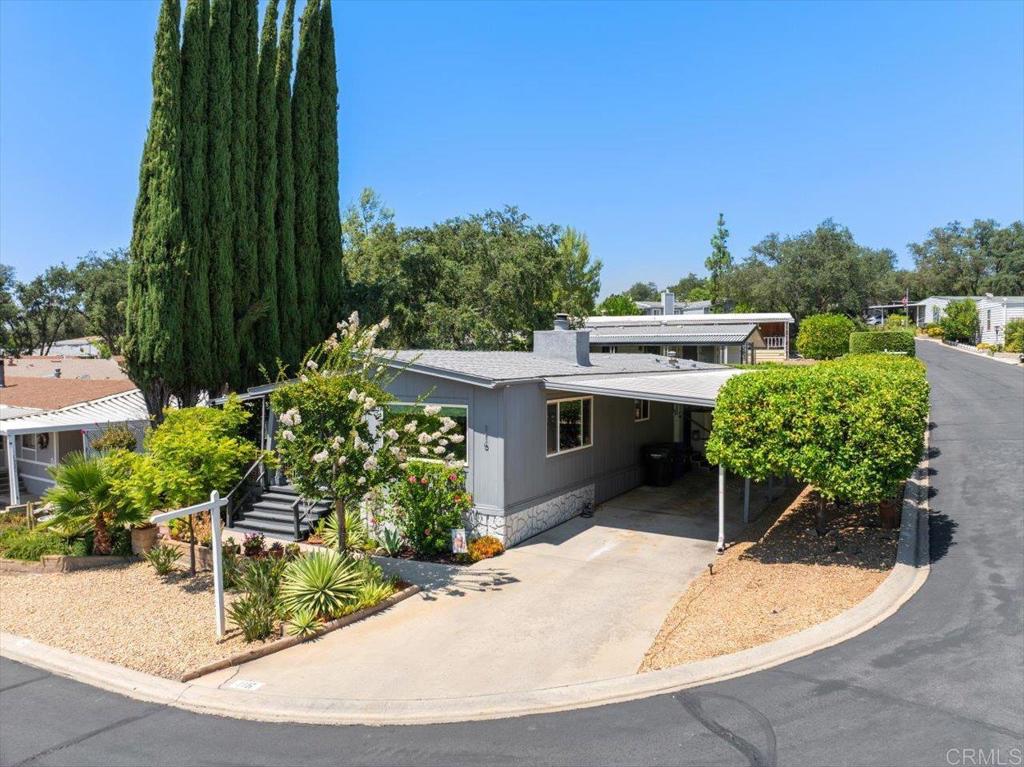18218 Paradise Mountain Road, Unit 116 Valley Center, CA 92082 - Photo 33 of 35 an aerial view of a house with a yard
