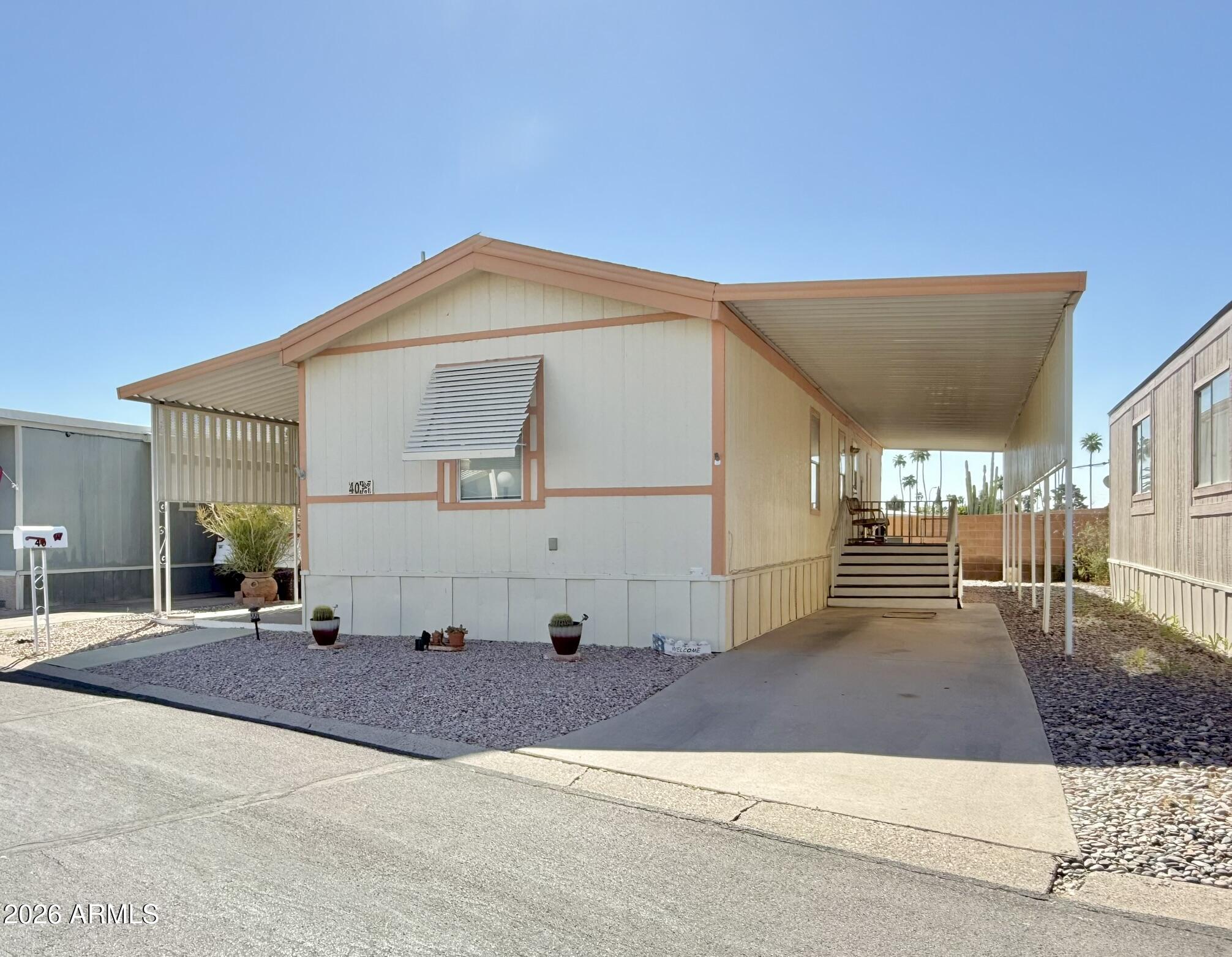 601 North Hayden Road, Unit 40 Scottsdale, AZ 85257 - Photo 1 of 48 a view of a house with a patio