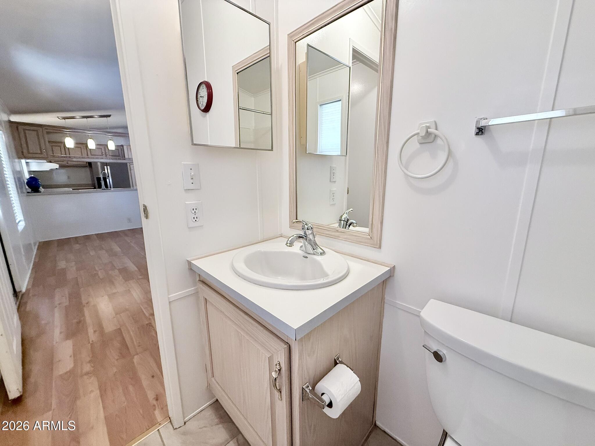 601 North Hayden Road, Unit 40 Scottsdale, AZ 85257 - Photo 17 of 48 a bathroom with a sink toilet and mirror