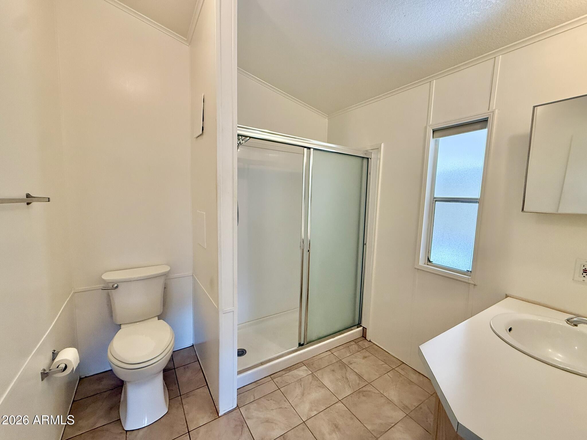 601 North Hayden Road, Unit 40 Scottsdale, AZ 85257 - Photo 20 of 48 a bathroom with a toilet sink and shower