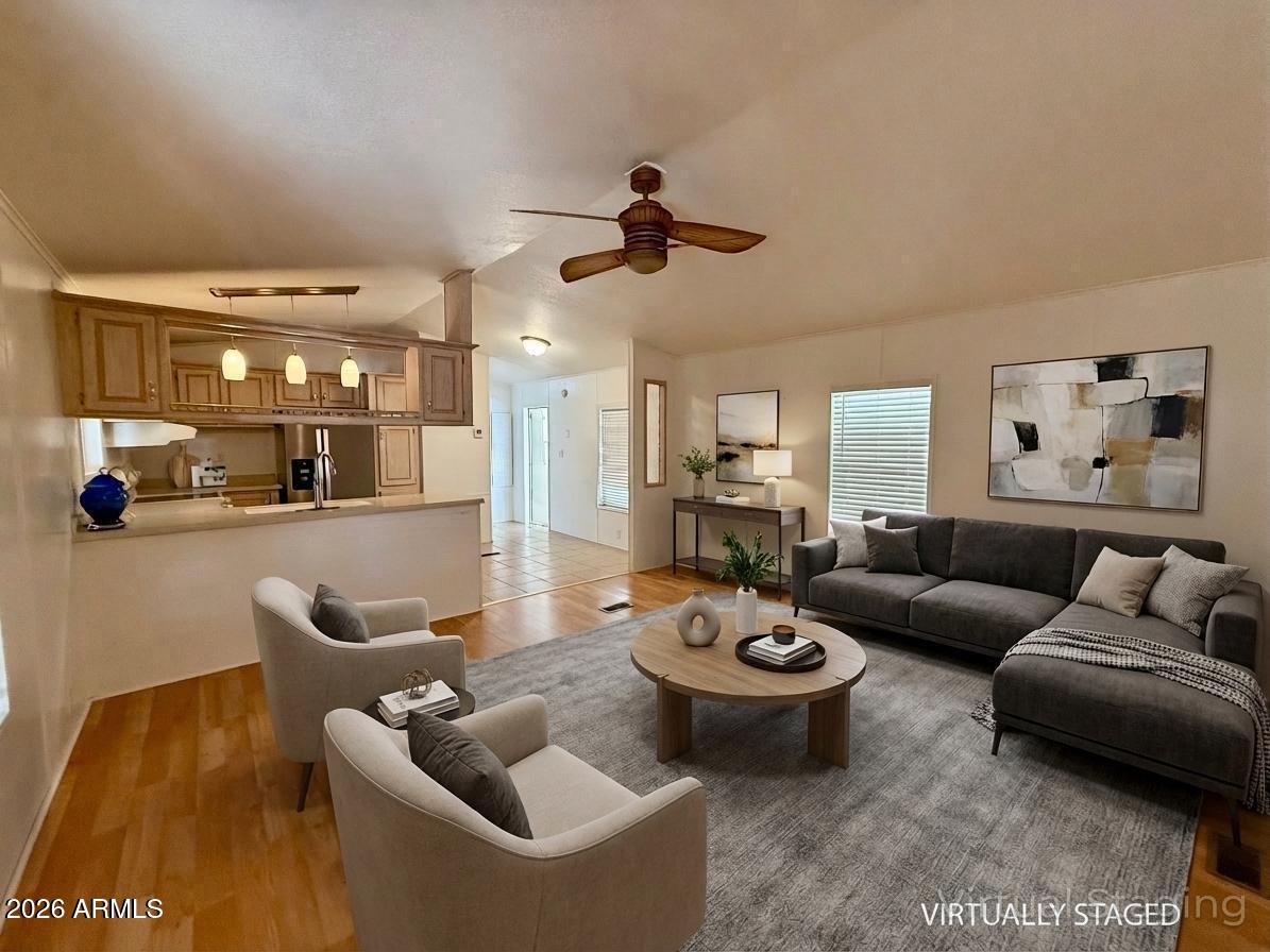 601 North Hayden Road, Unit 40 Scottsdale, AZ 85257 - Photo 2 of 48 a living room with furniture and wooden floor