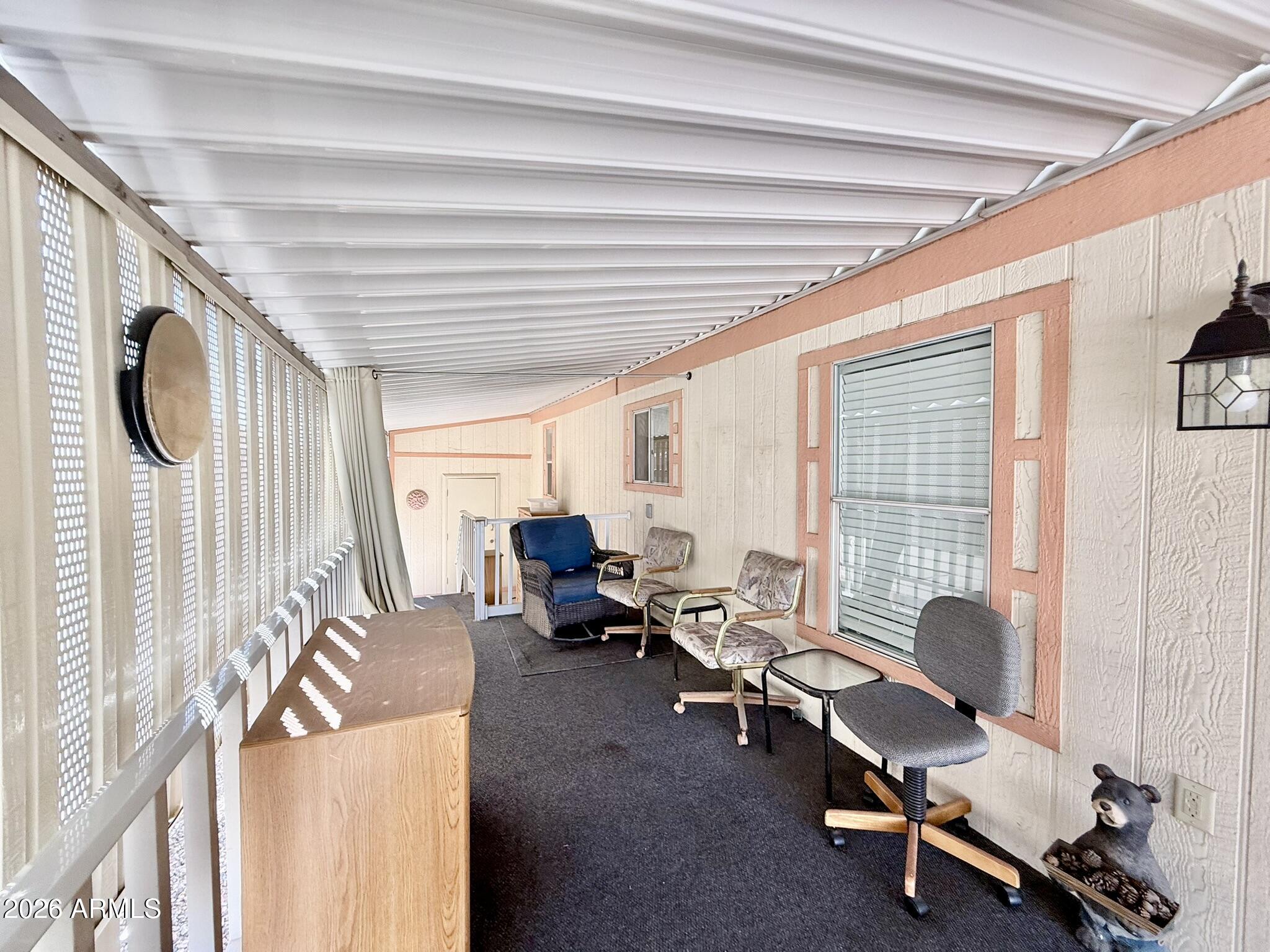 601 North Hayden Road, Unit 40 Scottsdale, AZ 85257 - Photo 29 of 48 a living room with furniture and a large window