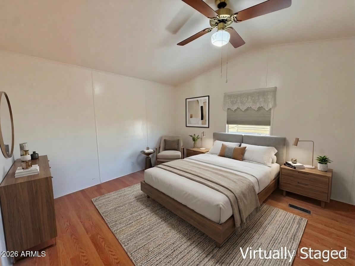 601 North Hayden Road, Unit 40 Scottsdale, AZ 85257 - Photo 4 of 48 a bedroom with a bed and a chandelier