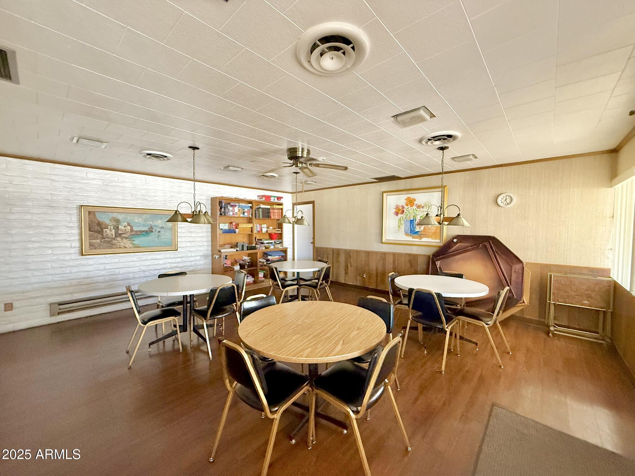 601 North Hayden Road, Unit 40 Scottsdale, AZ 85257 - Photo 47 of 48 a view of a dining room with furniture and wooden floor
