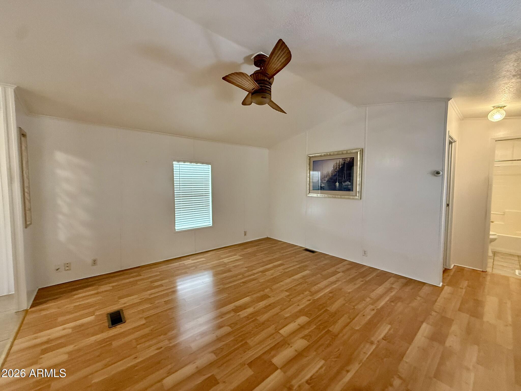 601 North Hayden Road, Unit 40 Scottsdale, AZ 85257 - Photo 6 of 48 a view of empty room with wooden floor