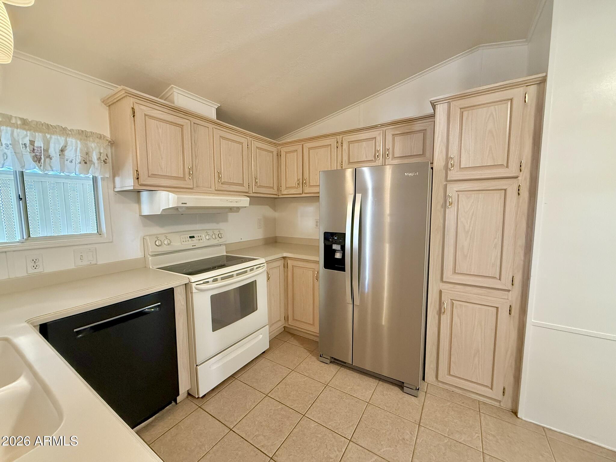 601 North Hayden Road, Unit 40 Scottsdale, AZ 85257 - Photo 10 of 48 a kitchen with white cabinets and white appliances