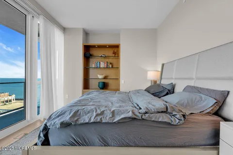 a bathroom with a double vanity sink mirror and shower