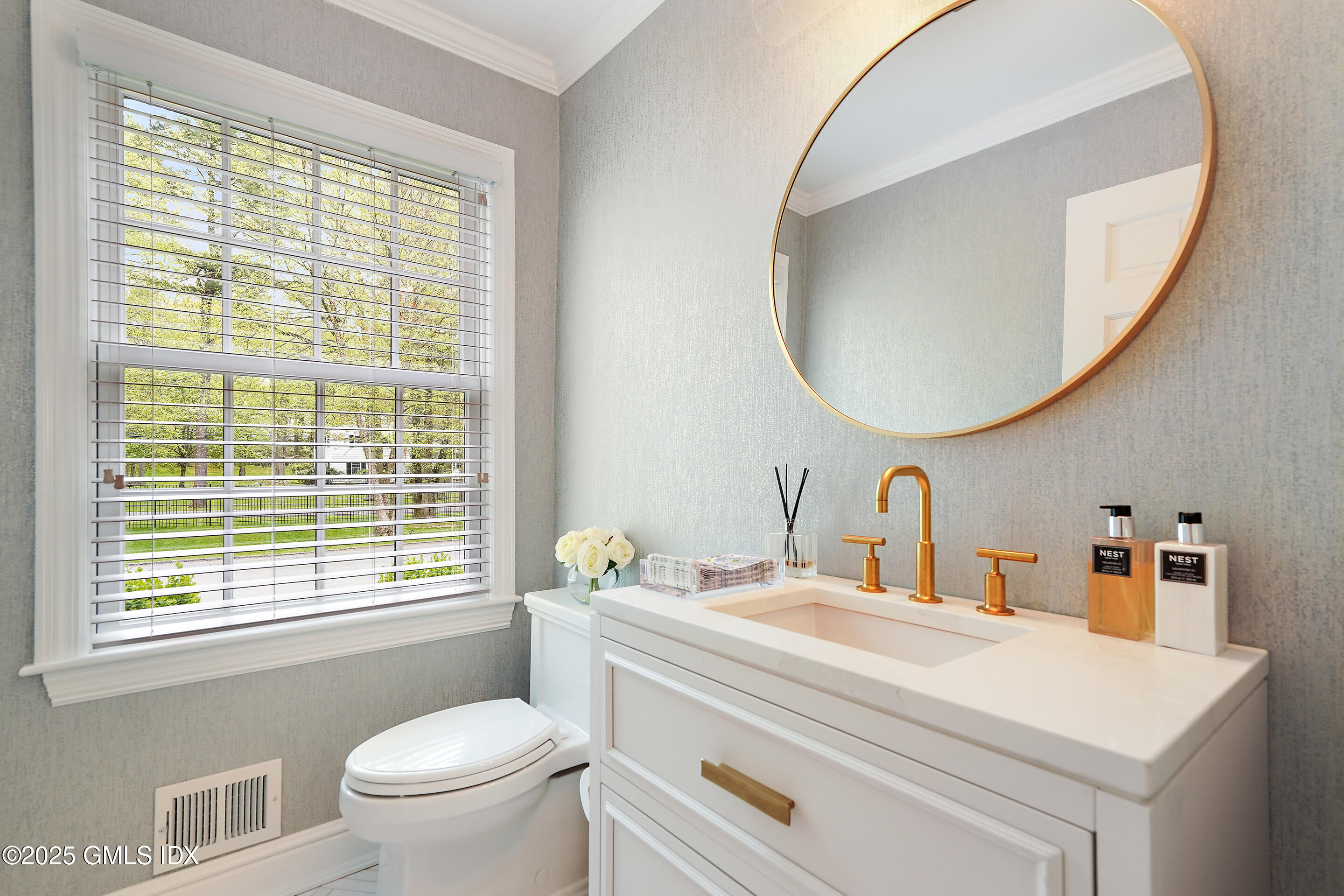 17 Will Merry Lane Greenwich, CT 06831 - Photo 14 of 49 a bathroom with a sink a toilet and a mirror