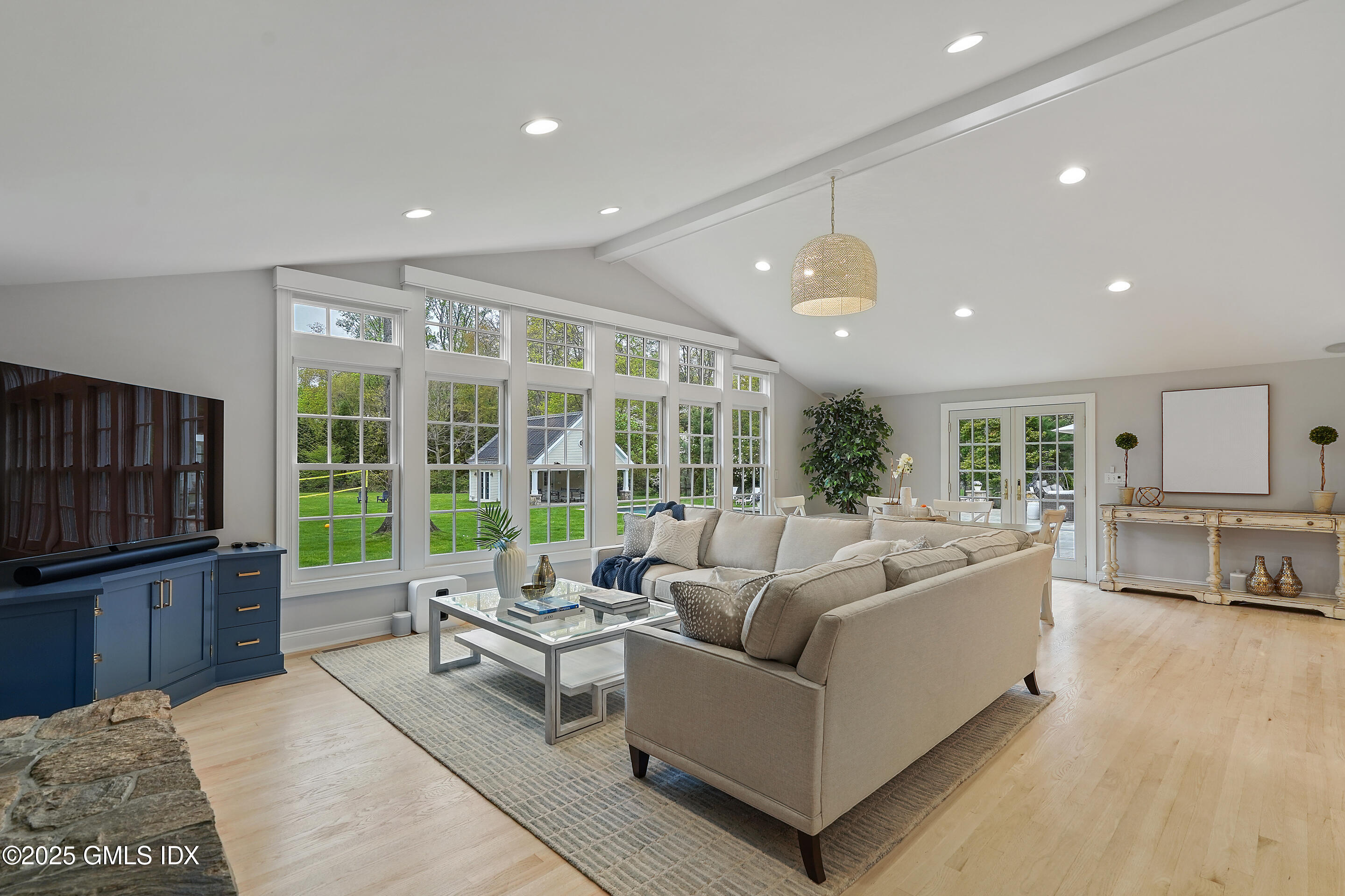 17 Will Merry Lane Greenwich, CT 06831 - Photo 20 of 49 a living room with furniture and a flat screen tv