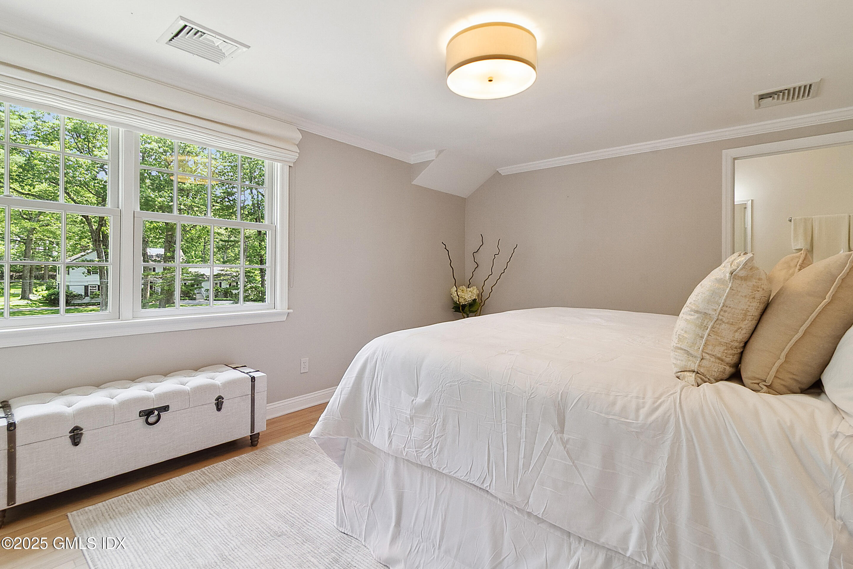 17 Will Merry Lane Greenwich, CT 06831 - Photo 32 of 49 a bedroom with a bed and a window