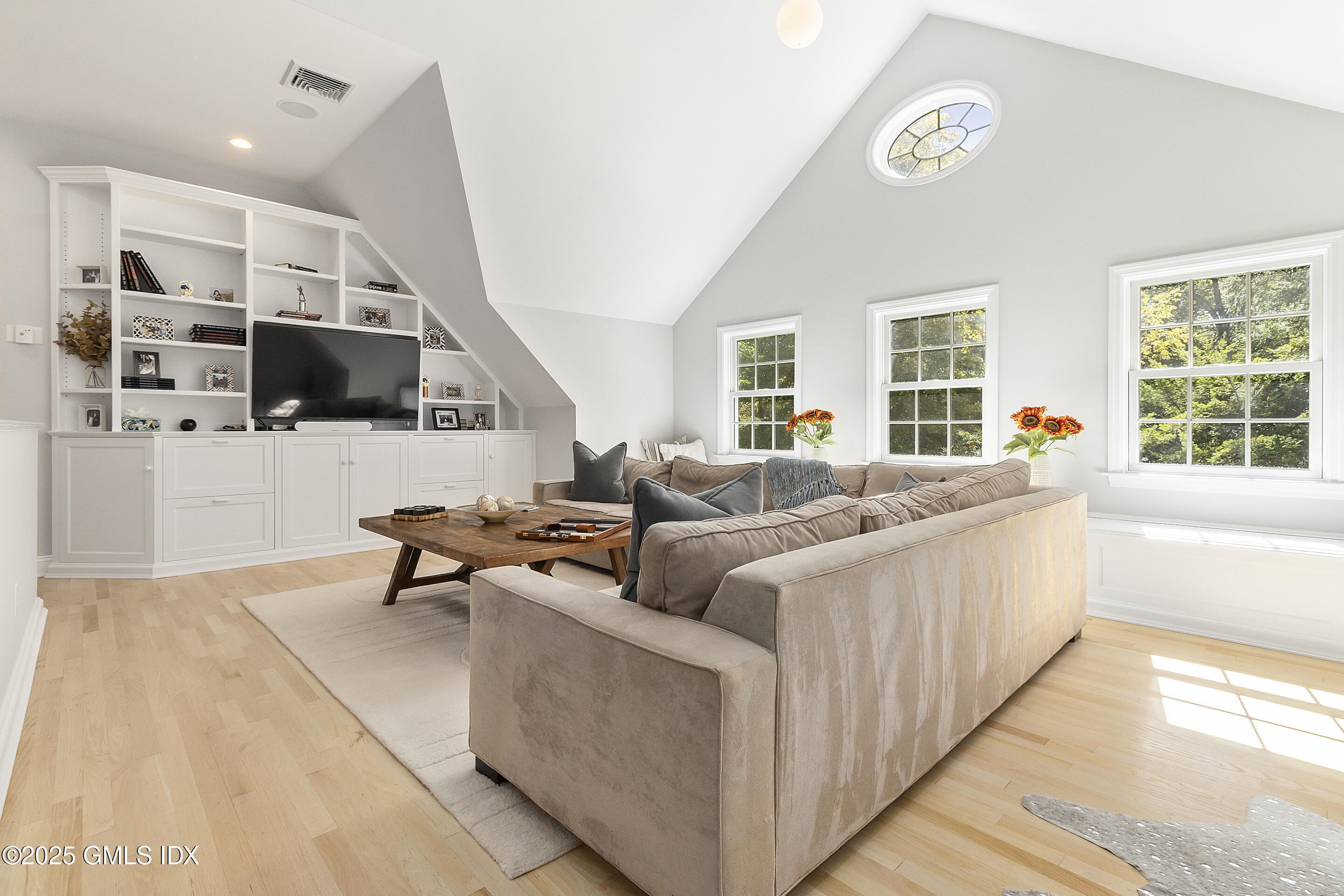 17 Will Merry Lane Greenwich, CT 06831 - Photo 36 of 49 a living room with furniture and a flat screen tv