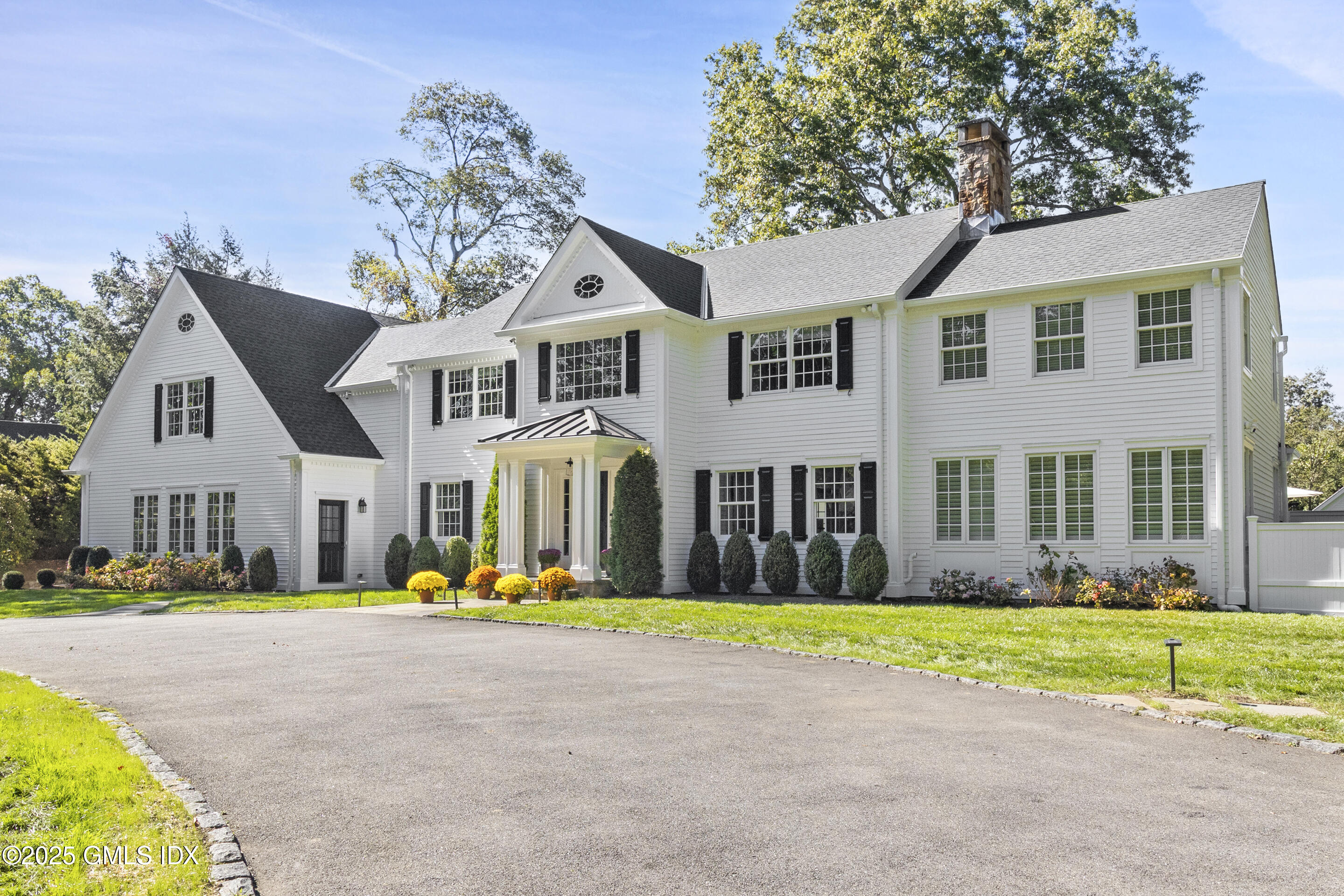 17 Will Merry Lane Greenwich, CT 06831 - Photo 4 of 49 a front view of the house with a yard