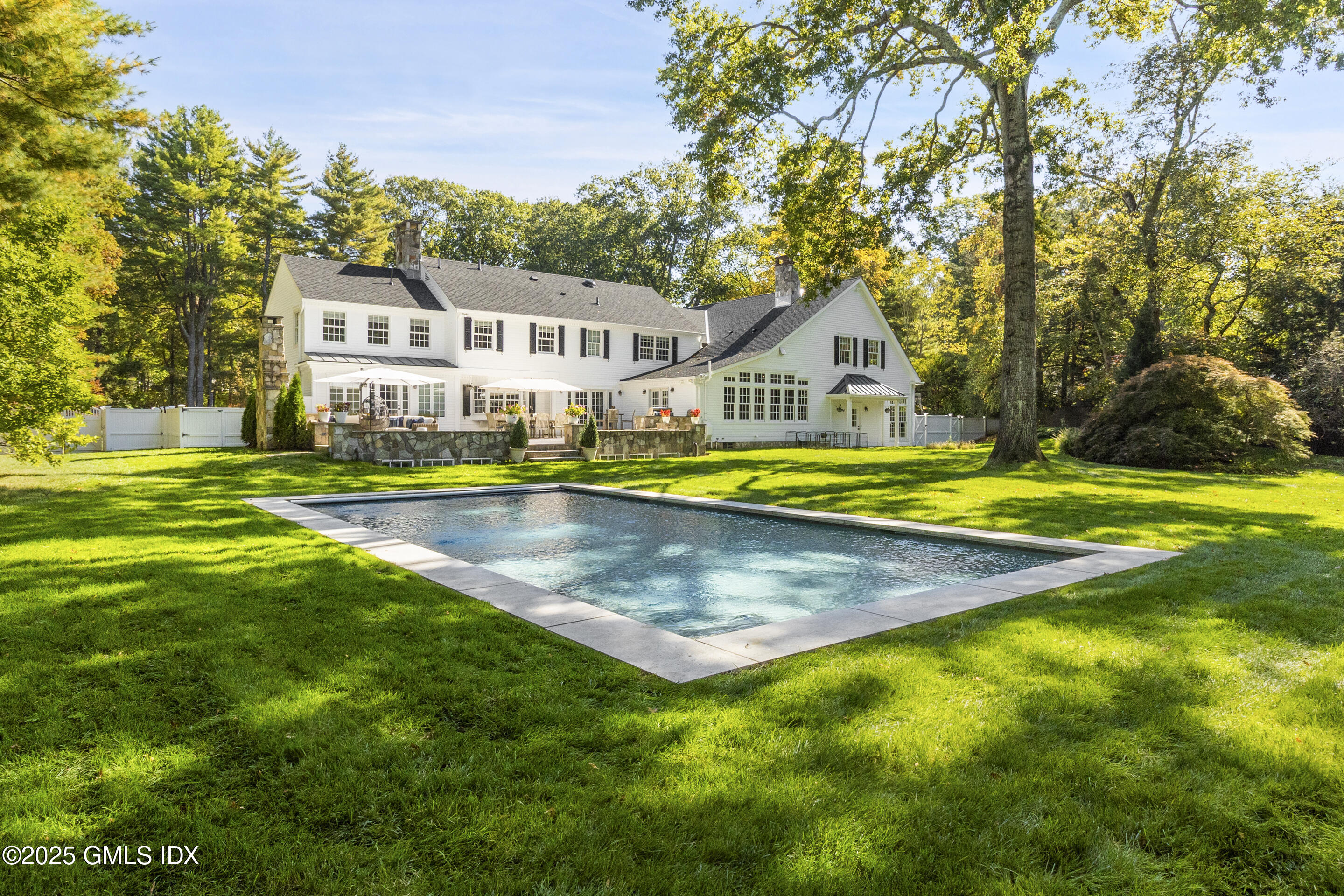 17 Will Merry Lane Greenwich, CT 06831 - Photo 41 of 49 a view of a house with swimming pool and a yard