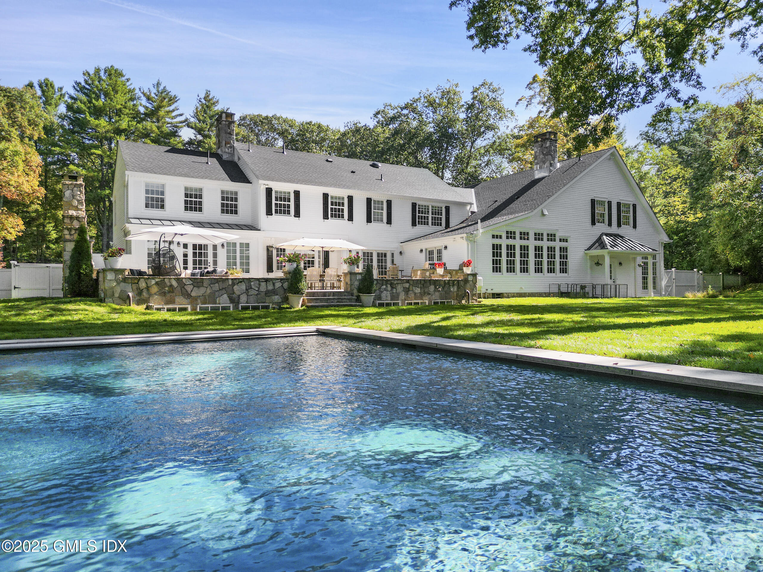17 Will Merry Lane Greenwich, CT 06831 - Photo 42 of 49 a view of a house with a big yard and large trees