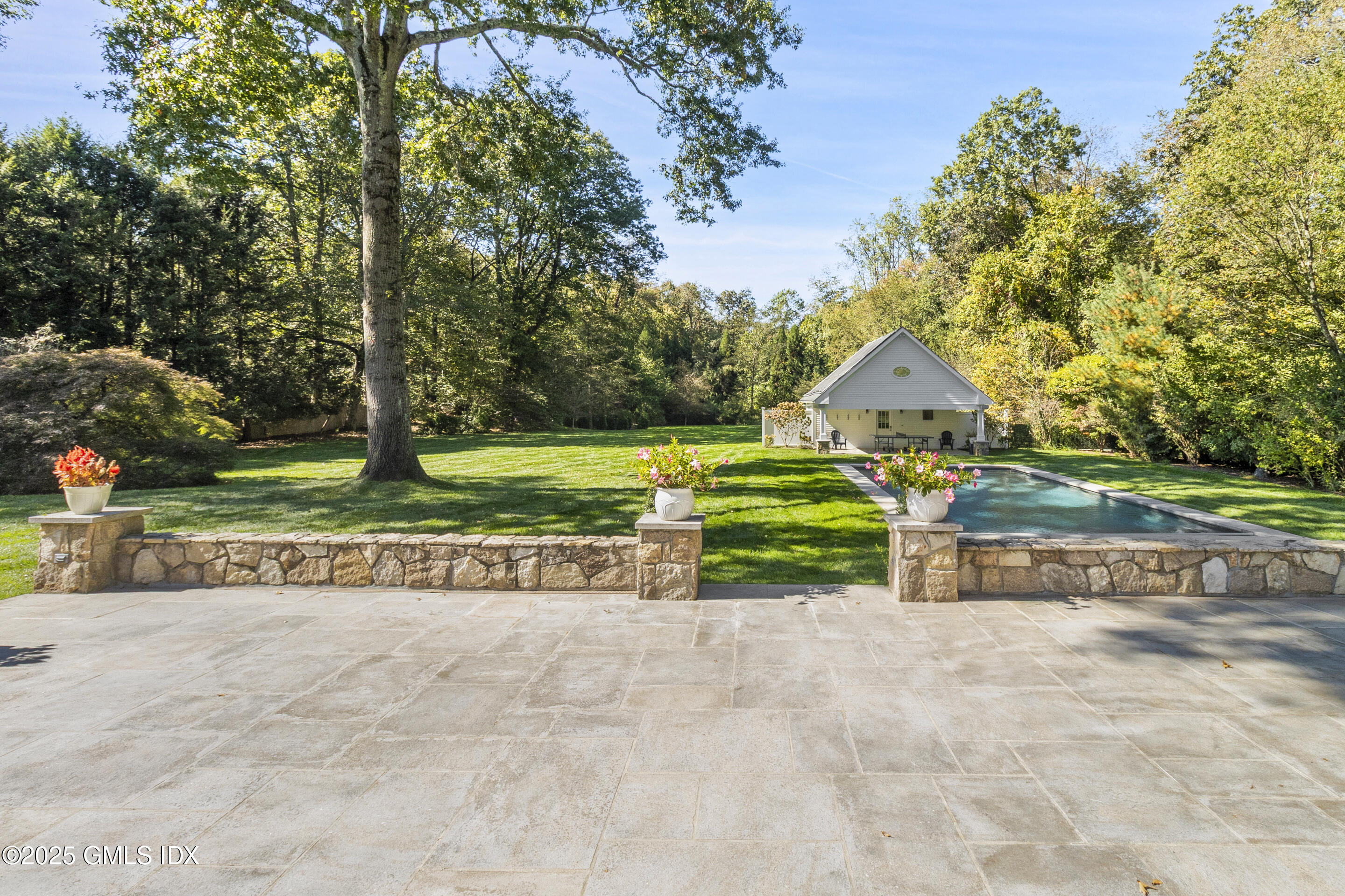 17 Will Merry Lane Greenwich, CT 06831 - Photo 46 of 49 a front view of a house with a yard