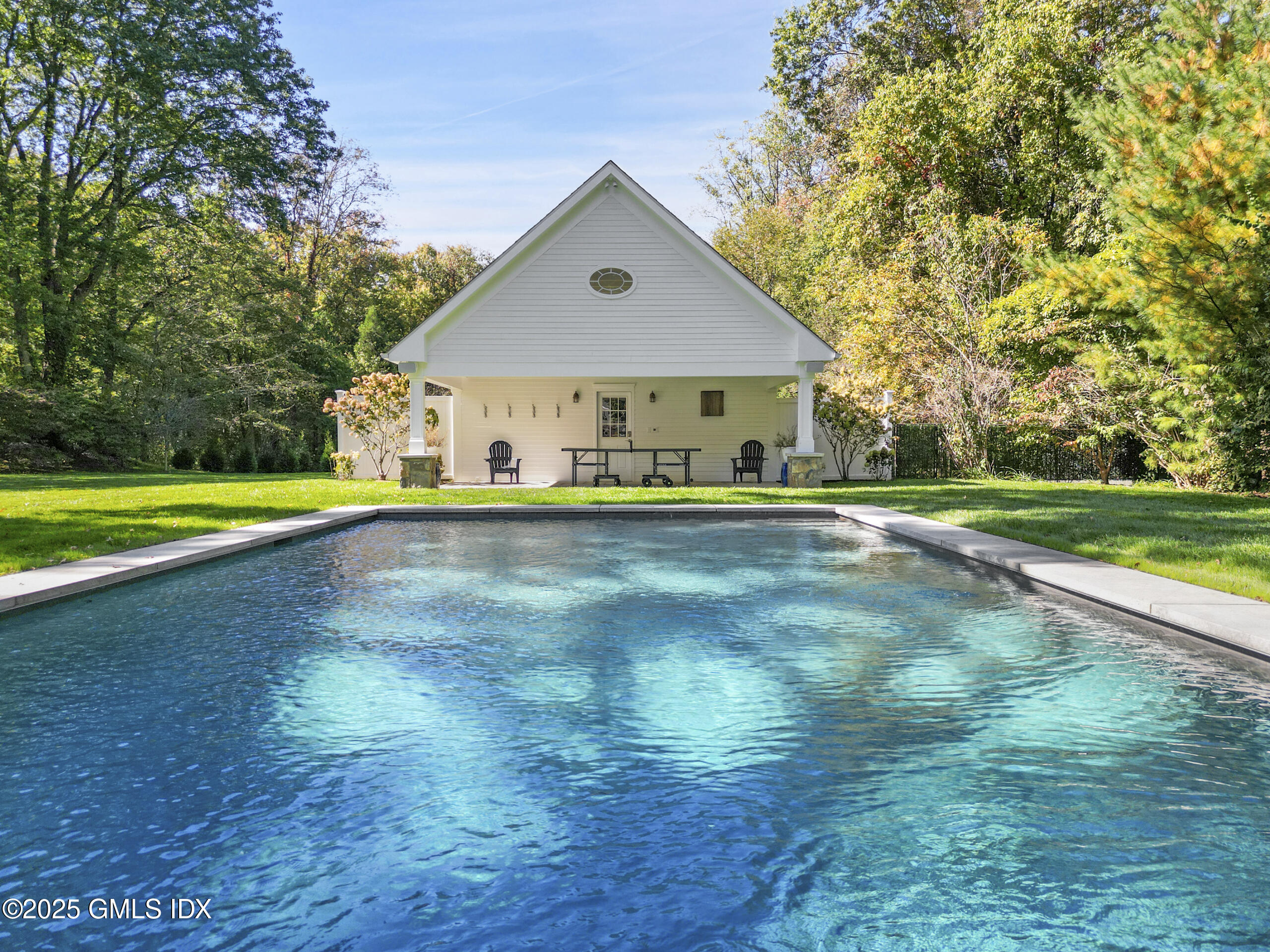 17 Will Merry Lane Greenwich, CT 06831 - Photo 48 of 49 a front view of a house with a yard and trees