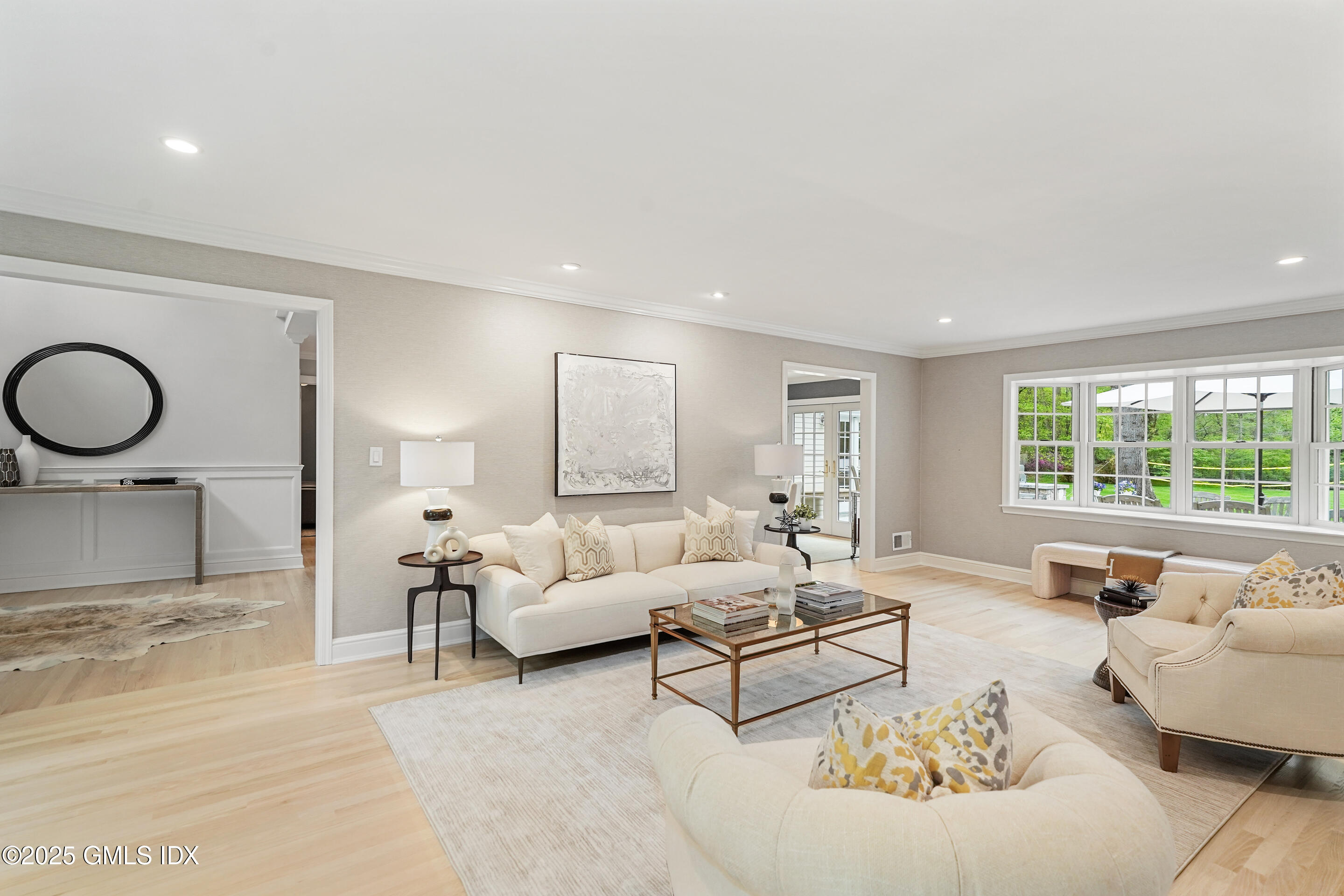 17 Will Merry Lane Greenwich, CT 06831 - Photo 8 of 49 a living room with furniture and a large window