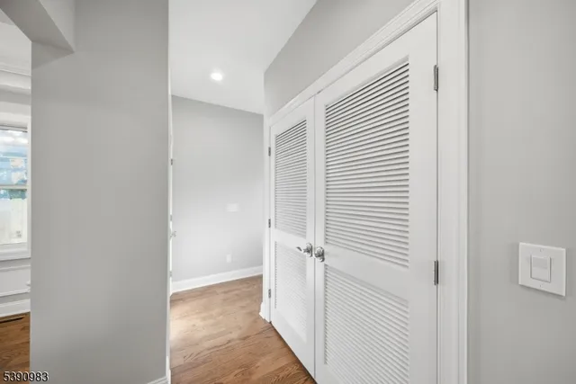 a view of a hallway with closet