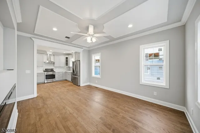 a view of a kitchen with a sink and a window