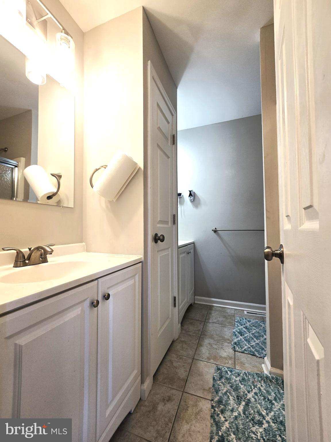 3 Arnold Place Newark, DE 19702 - Photo 17 of 28 a bathroom with a sink a toilet and shower