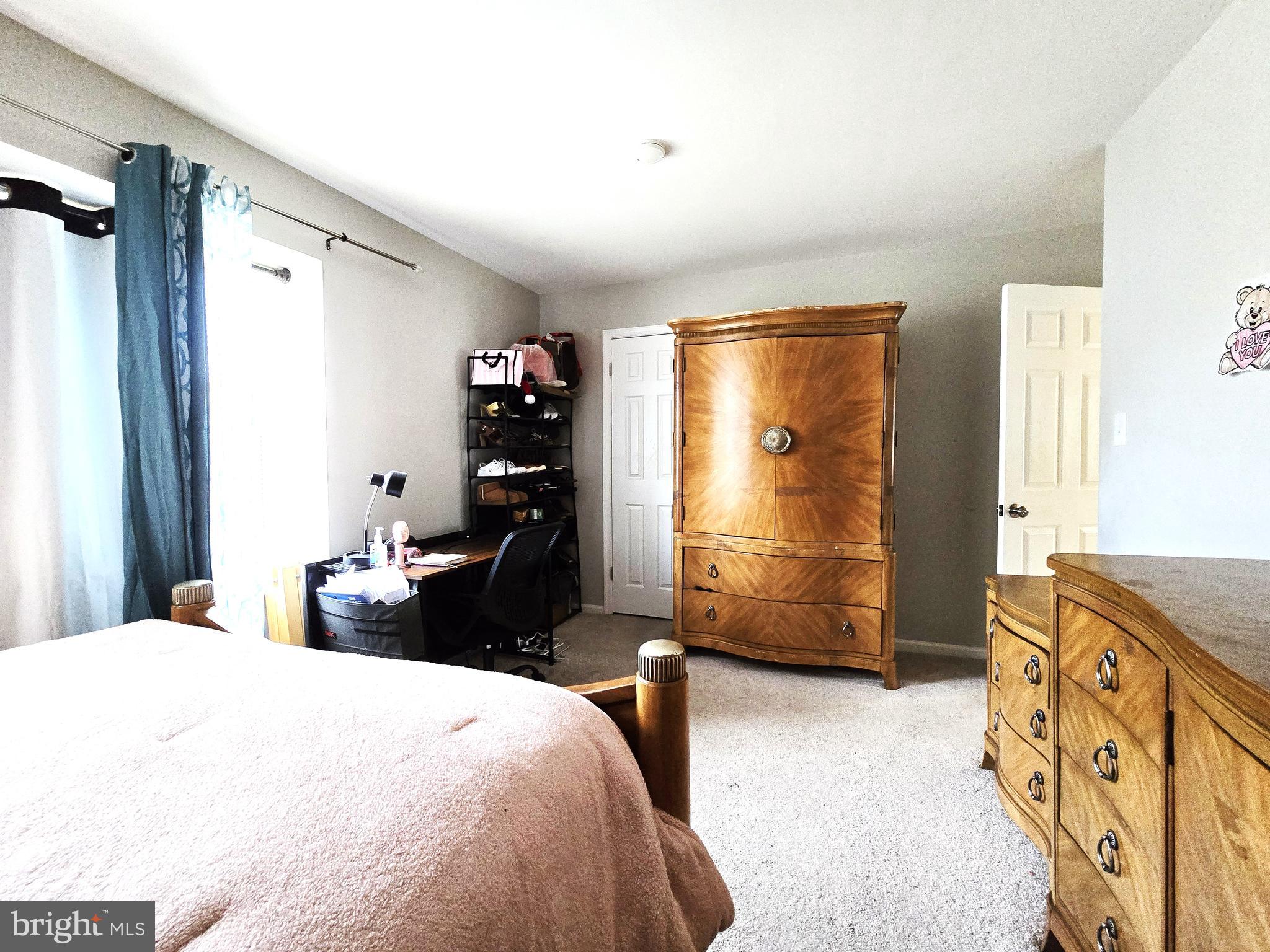 3 Arnold Place Newark, DE 19702 - Photo 21 of 28 a bedroom with a bed and a dresser